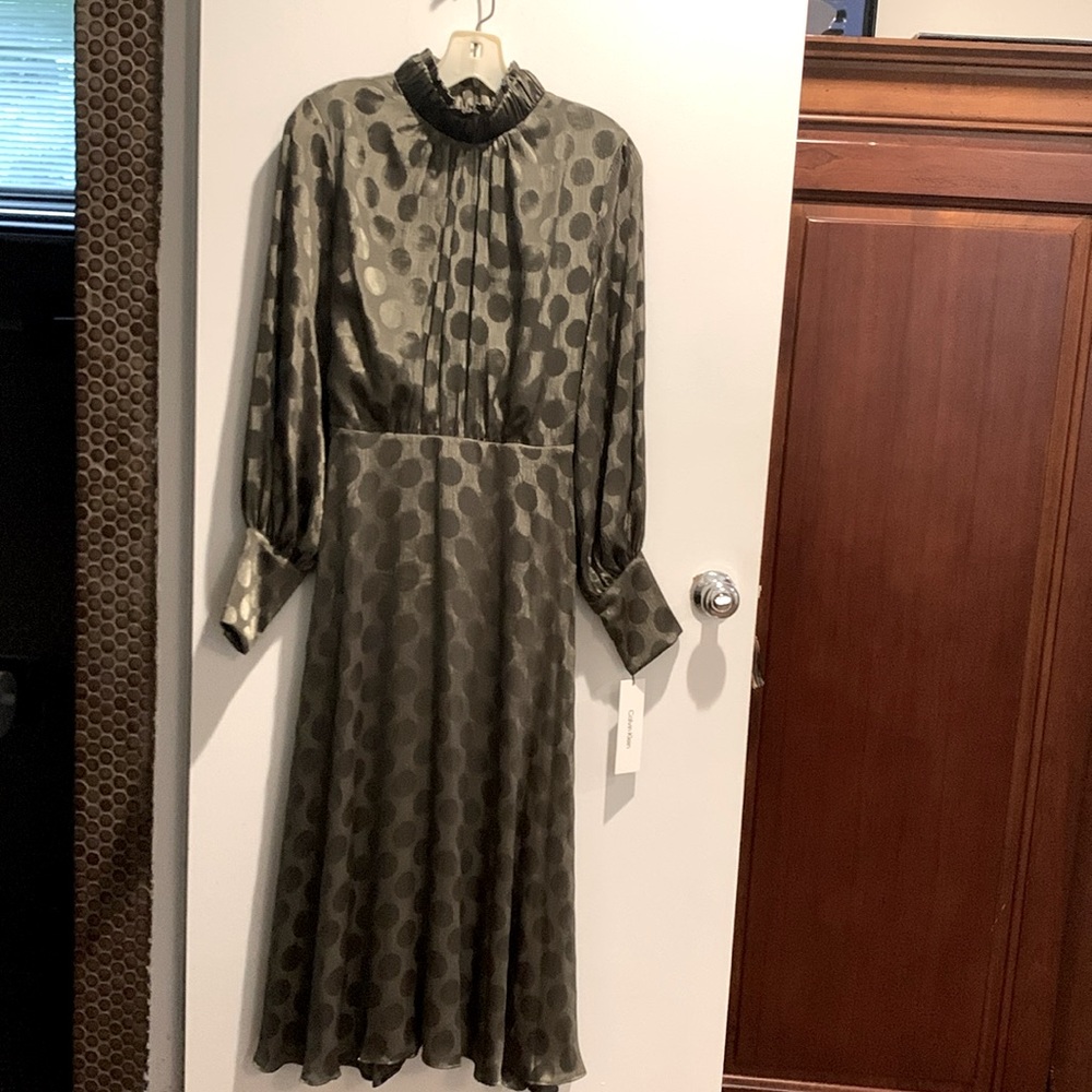 Silky Calvin Klein Dress. Caper green color. Size 6. I am 5’2 ,falls mid calf .